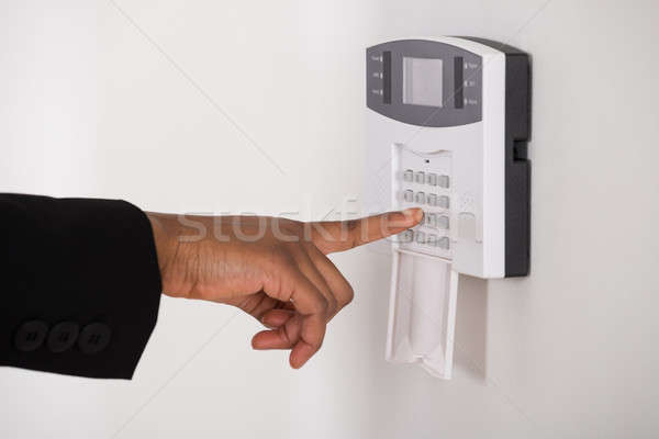 Businesswoman Hand Entering Code In Security System Stock photo © AndreyPopov