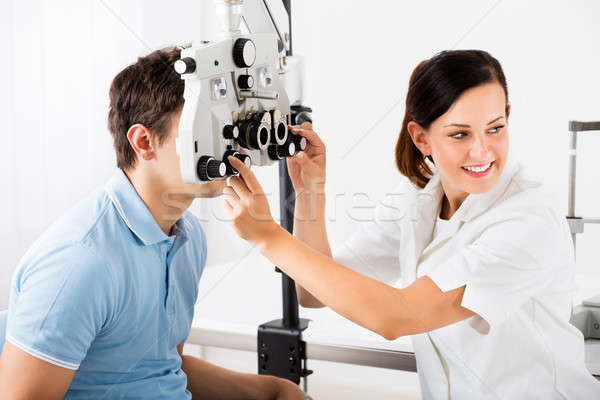 Female Optometrist Doing Sight Testing For Patient Stock photo © AndreyPopov