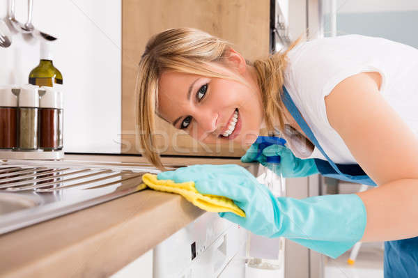 Close-up Of Woman Cleaning Kitchen Worktop Stock photo © AndreyPopov