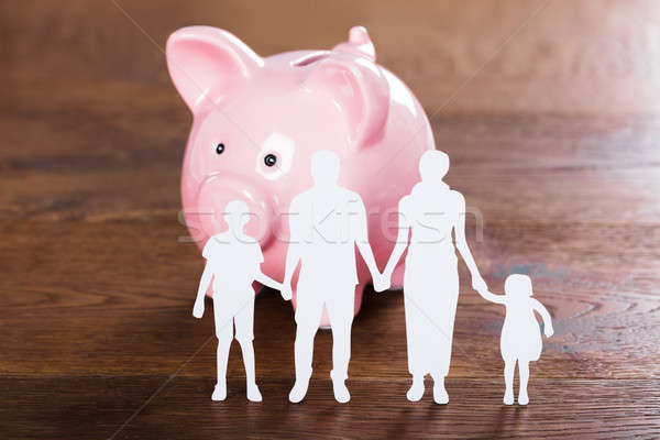 Family Saving Concept On Wooden Desk Stock photo © AndreyPopov