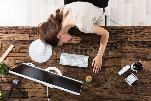 Businesswoman Sleeping In Office Stock photo © AndreyPopov