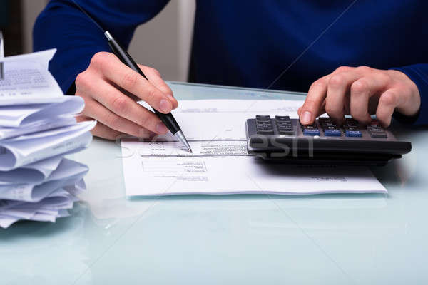 Businessperson Calculating Bill Stock photo © AndreyPopov