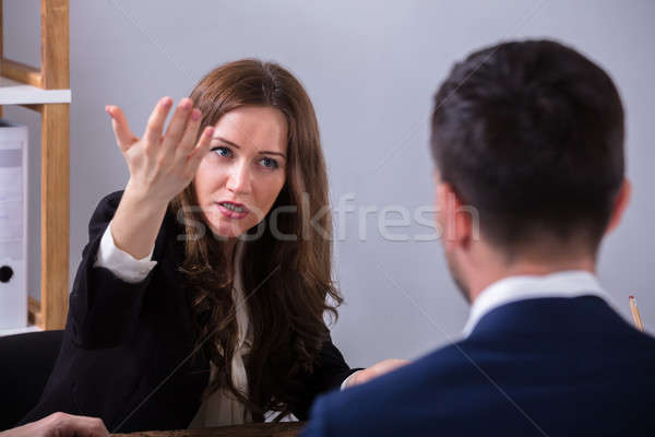 Businesswoman Scolding Her Colleague Stock photo © AndreyPopov