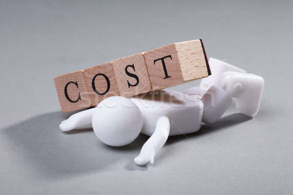 Költség fakockák emberi alkat fehér szobrocska Stock fotó © AndreyPopov