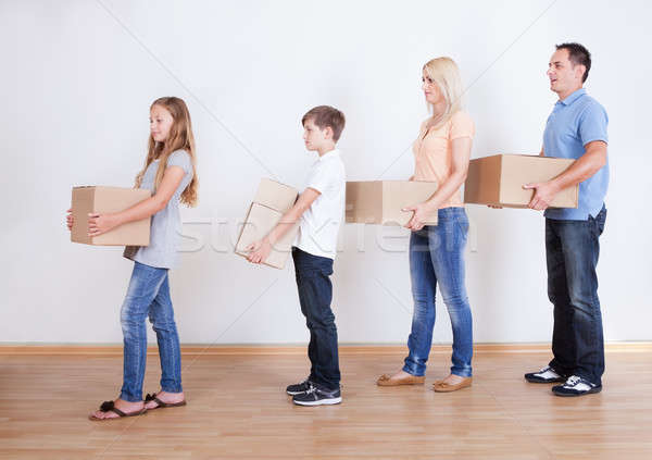 Parents And Two Children With Cardboard Boxes Stock photo © AndreyPopov