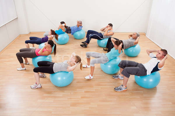 Class of diverse people doing pilates Stock photo © AndreyPopov