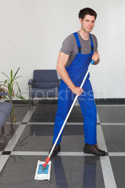 Man Cleaning The Floor Stock photo © AndreyPopov