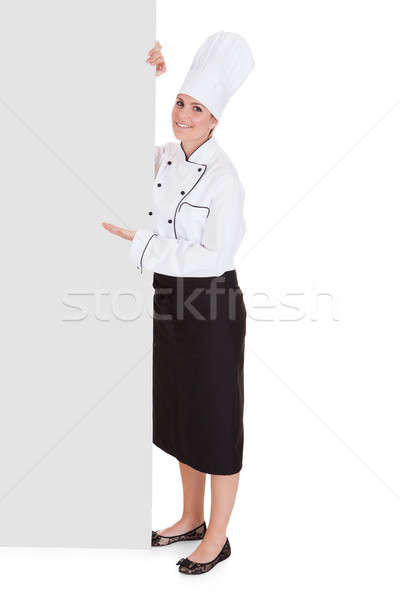 Female Chef Showing Blank Placard Stock photo © AndreyPopov