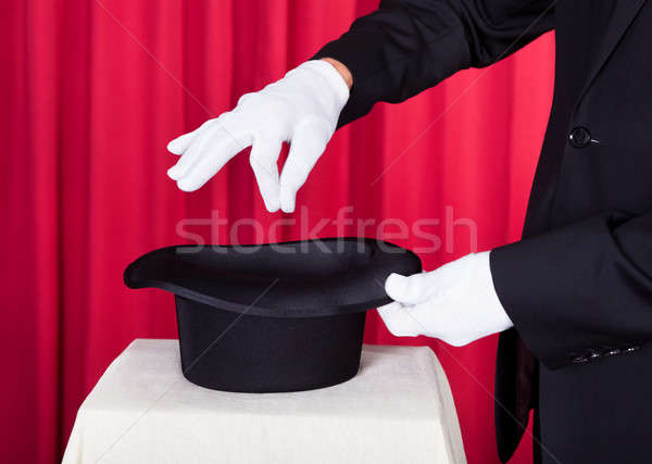 A Magician Performing Magic With Hat Stock photo © AndreyPopov