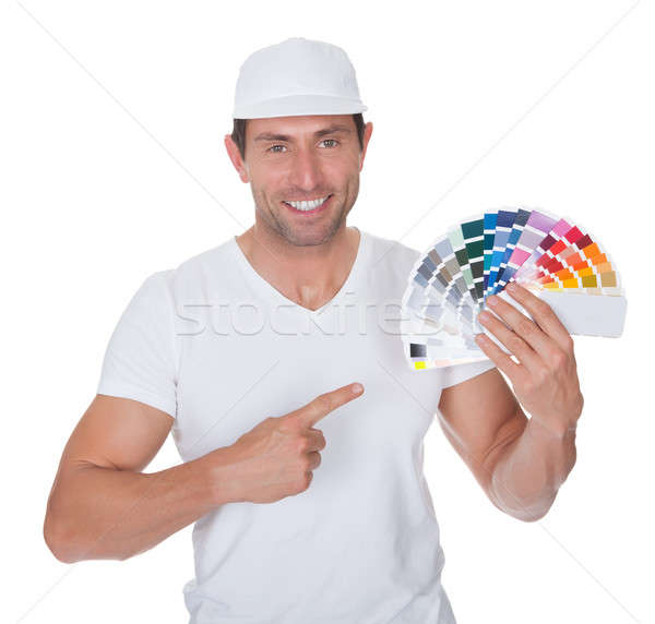 Stock photo: Painter Holding A Paint Roller And Spectrum