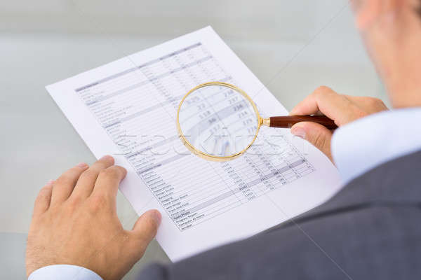 Auditor inspecting document Stock photo © AndreyPopov