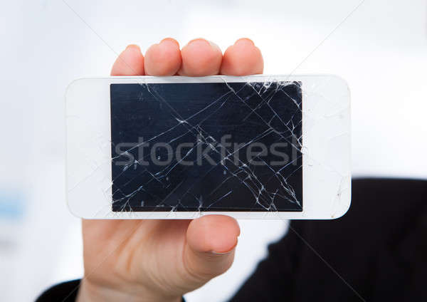 Person halten beschädigt Mobiltelefon Hand Stock foto © AndreyPopov