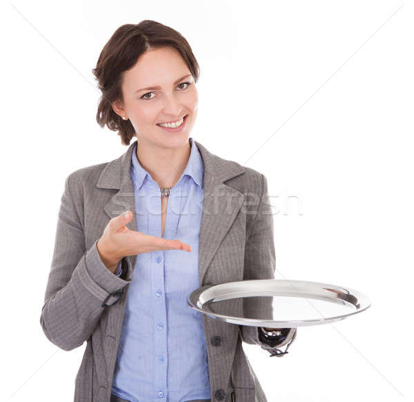 Businesswoman Holding Empty Plate Stock photo © AndreyPopov