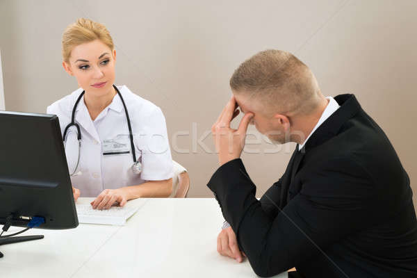 Stock photo: Female Doctor Looking At Patient