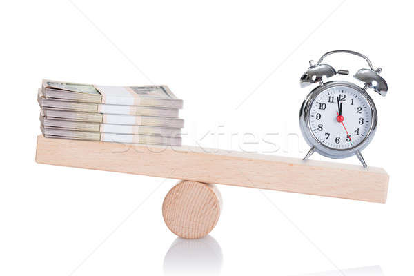 Alarmclock And Dollar Bundles Balancing On Seesaw Stock photo © AndreyPopov