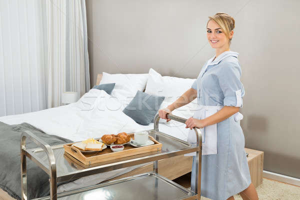 Stock photo: Woman Pushing Trolley With Breakfast