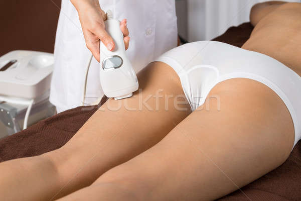 Nő lézer terápia comb közelkép epiláció Stock fotó © AndreyPopov