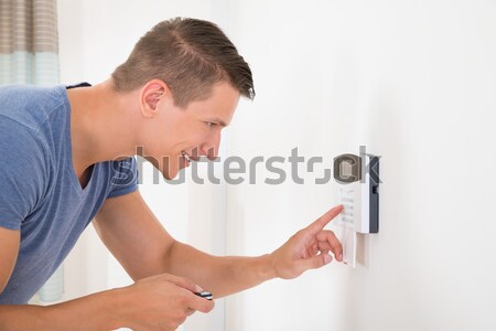 Man Entering Code In Door Security System Stock photo © AndreyPopov
