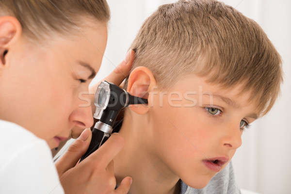 Stock photo: Doctor Examining Boy's Ear