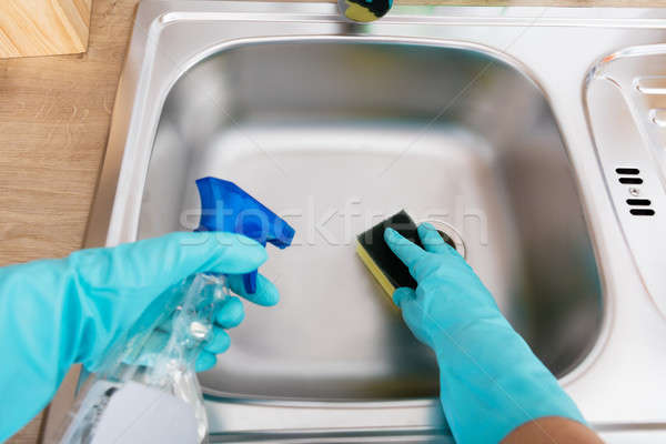 Személy kezek takarítás mosogató közelkép spray Stock fotó © AndreyPopov