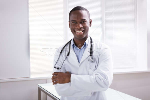Portrait Of Smiling Male Doctor In Clinic Stock photo © AndreyPopov