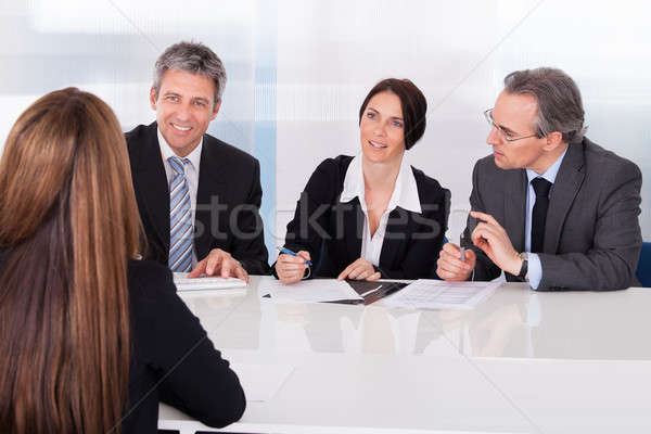 Businesspeople Interviewing Woman Stock photo © AndreyPopov