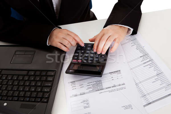 Accountant doing calculations Stock photo © AndreyPopov