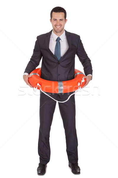 Young businessman with life buoy Stock photo © AndreyPopov