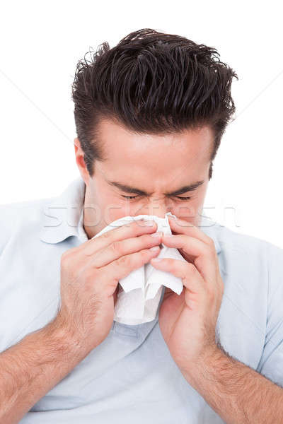 Człowiek tkanka młody człowiek dmuchanie nosa biały medycznych Zdjęcia stock © AndreyPopov