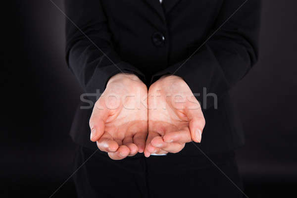 Midsection Of Businesswoman With Cupped Hands Stock photo © AndreyPopov