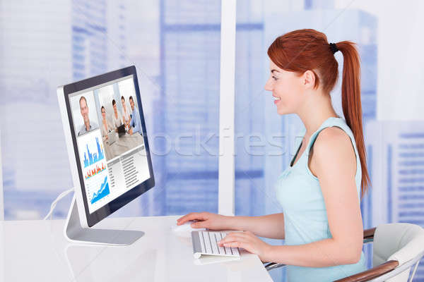 Businesswoman Video Conferencing With Team On Computer Stock photo © AndreyPopov