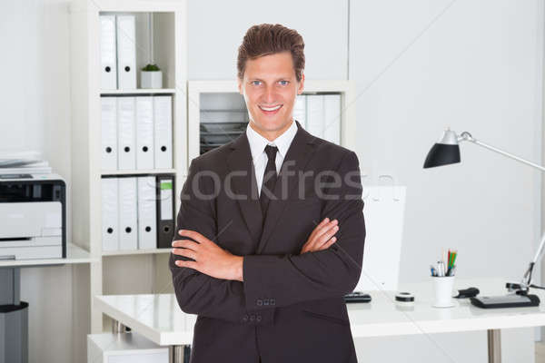 Mid Adult Businessman Standing Arms Crossed Stock photo © AndreyPopov