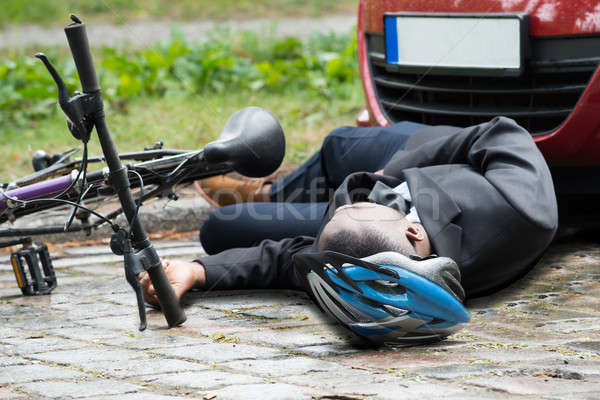 Kerékpáros utca baleset fiatal afrikai férfi Stock fotó © AndreyPopov