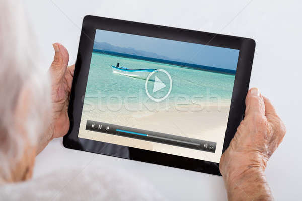Senior Woman Watching Video On Digital Tablet Stock photo © AndreyPopov