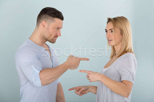 Couple Pointing At Each Other Stock photo © AndreyPopov