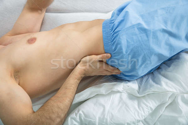 Man Suffering From Back Pain At Home Stock photo © AndreyPopov
