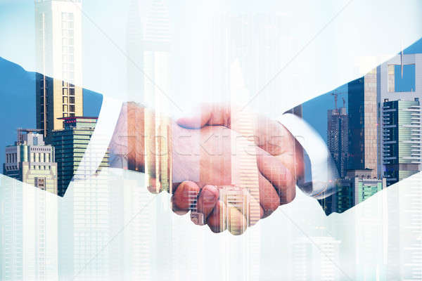 Business People Shaking Hands Over City Background Stock photo © AndreyPopov