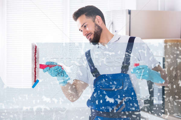 Janitor Cleaning Window With Squeegee Stock photo © AndreyPopov