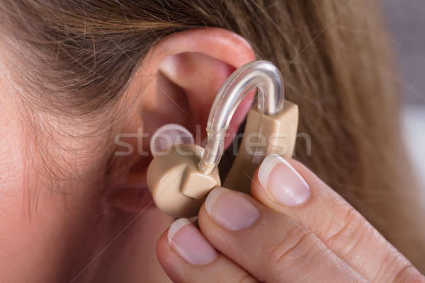 Kobieta aparat słuchowy Fotografia medycznych Zdjęcia stock © AndreyPopov