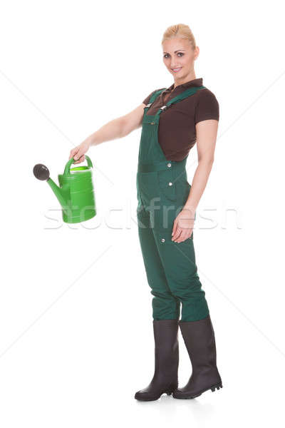 Portrait Of A Female Worker Holding Watering Can Stock photo © AndreyPopov