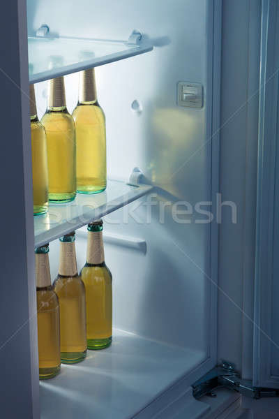 Alcoholic bottles arrange in refrigerator Stock photo © AndreyPopov