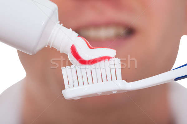 Homme brosse à dents dentifrice homme fond [[stock_photo]] © AndreyPopov