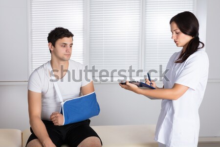 Lekarza ciśnienie krwi młoda kobieta odizolowany biały kobieta Zdjęcia stock © AndreyPopov