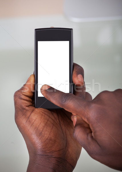 Person Holding Cellphone Stock photo © AndreyPopov