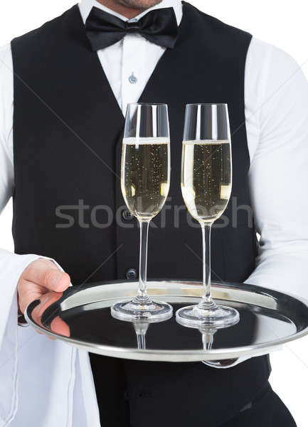 Waiter Carrying Champagne Flutes On Tray Stock photo © AndreyPopov