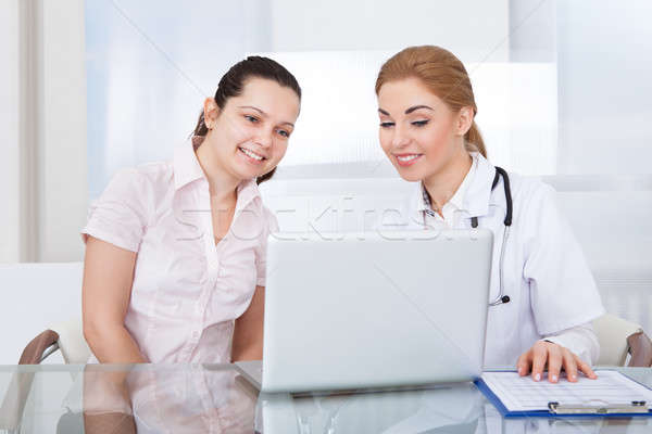 Doctor And Patient Looking At Laptop Stock photo © AndreyPopov