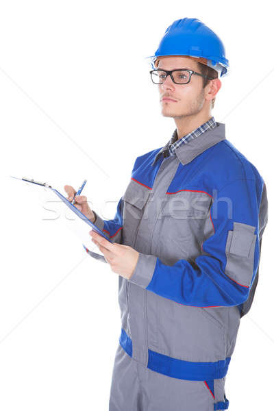 Male Construction Reviewer Holding Pen And Clipboard Stock photo © AndreyPopov