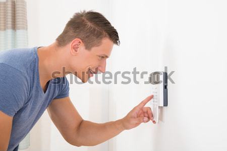 Man Entering Code In Door Security System Stock photo © AndreyPopov