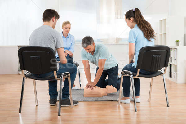 Stock photo: Instructor Teaching First Aid Cpr Technique