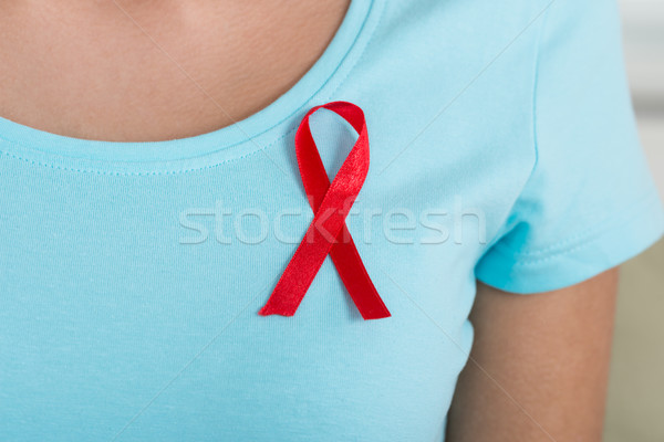 Woman Wearing Aids Awareness Ribbon Stock photo © AndreyPopov